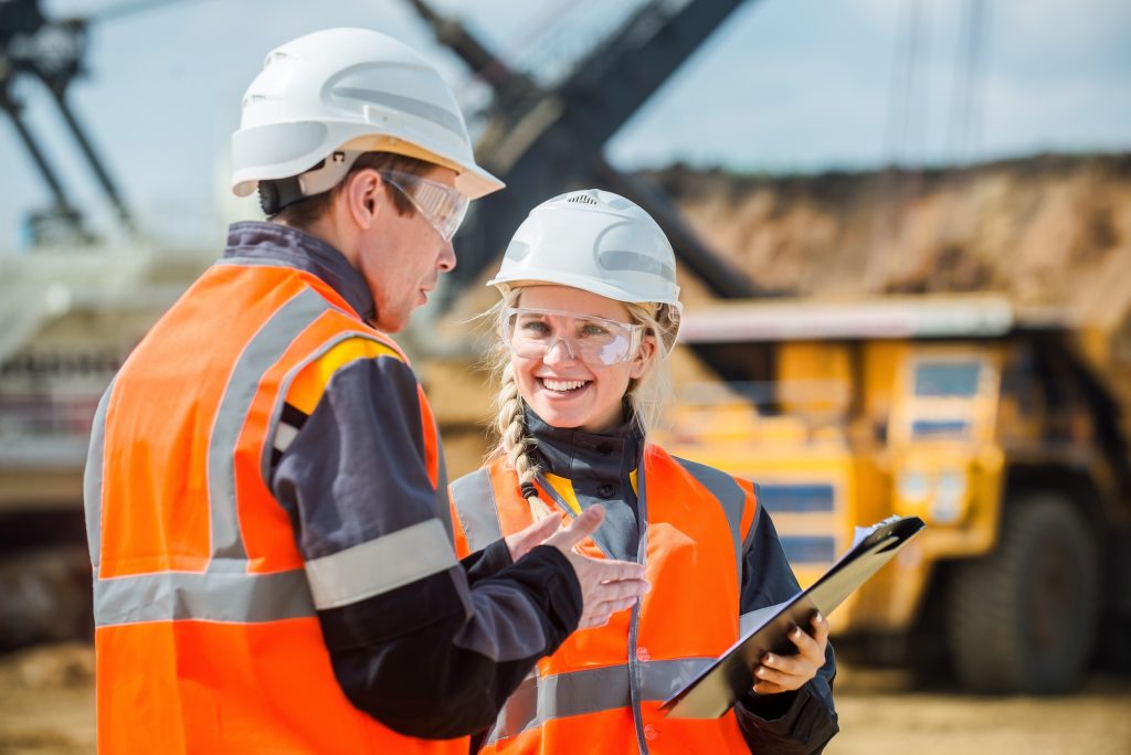 Man and woman working in an open-pit